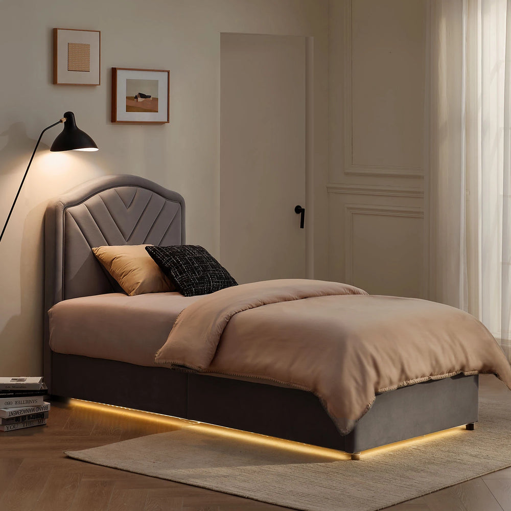 Luniva Grey Single Bed Frame with warm LED lighting in a night-time bedroom