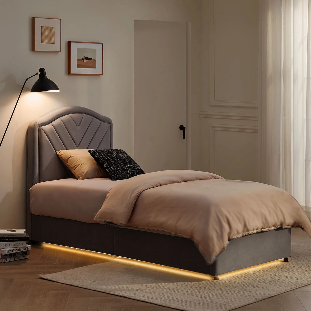 Luniva Grey Single Bed Frame with warm LED lighting in a night-time bedroom