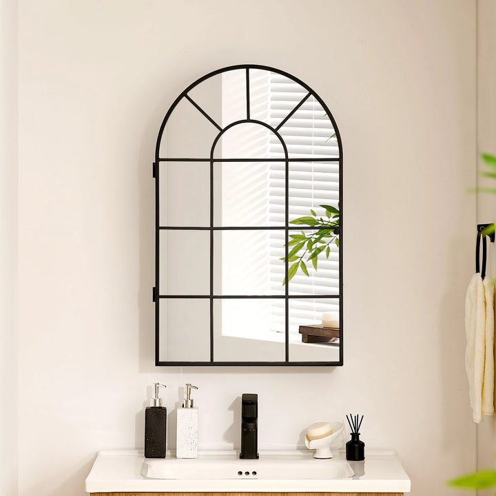 Margot arched Mirror above bathroom sink, cabinet doors closed
