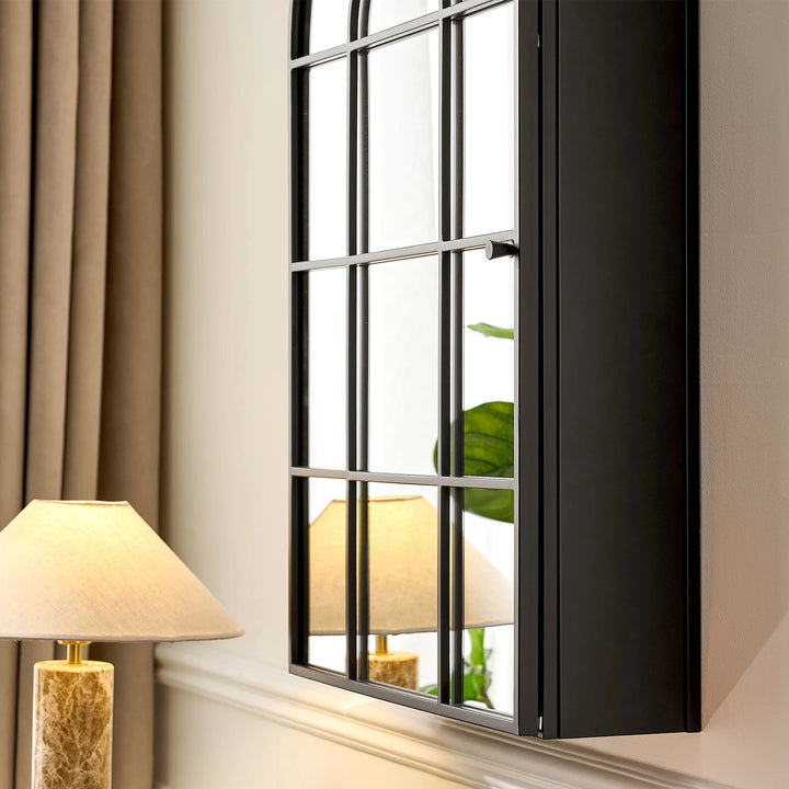 Side view close-up of Margot arched Mirror cabinet hanging on wall, showing metal frame and mirror details