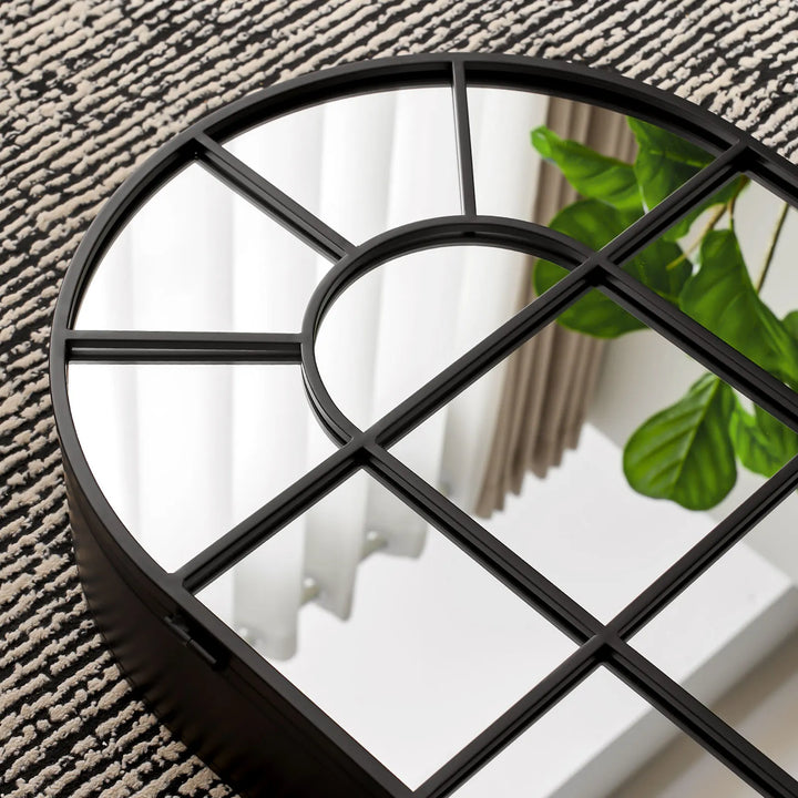 Close-up of Margot arched Mirror cabinet black metal frame and mirror, highlighting fine details