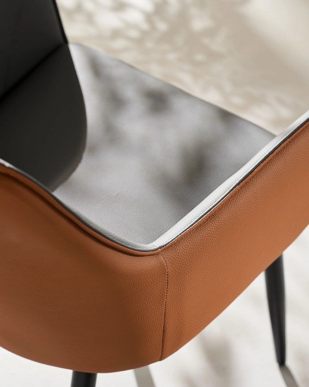grey Maxine Dining Chair top view showing two-tone faux leather and armrest detail