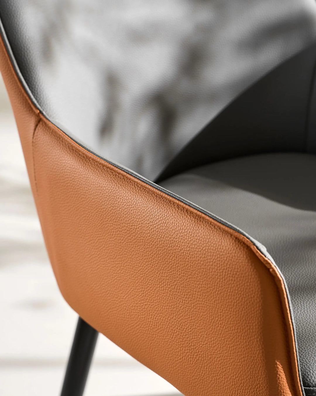 grey Maxine Dining Chair side view with textured faux leather upholstery detail