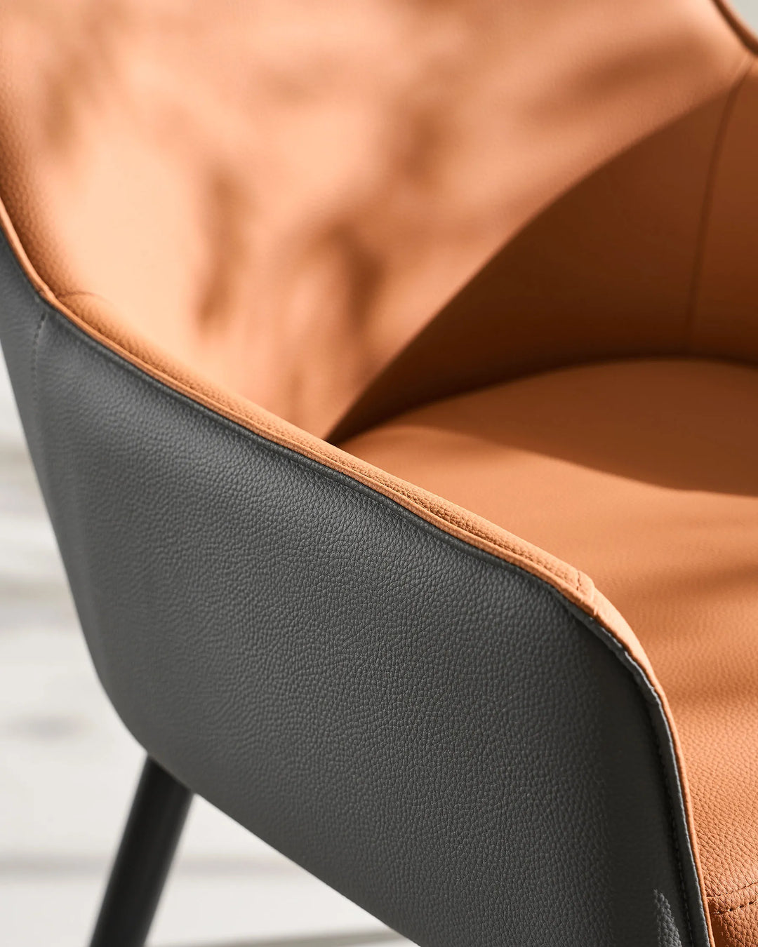 Brown Maxine Dining Chair side view with textured faux leather upholstery detail