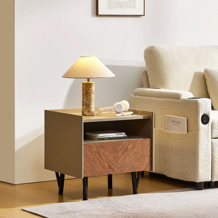 Side view of Milano Bedside Table beside beige Clarkson 3-Seater Boucle Sofa in a bright living room