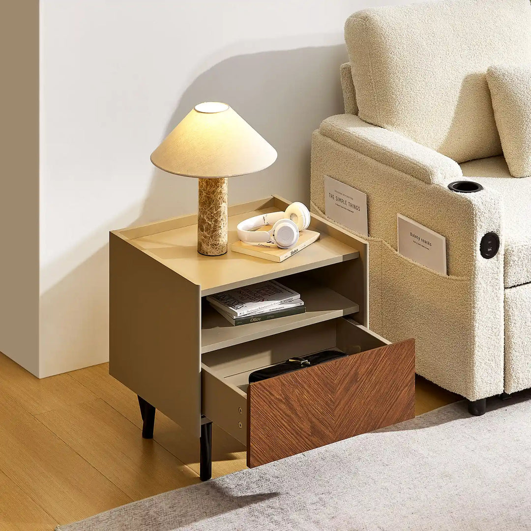 Top view of Milano Bedside Table beside beige Clarkson 3-Seater Boucle Sofa in a bright living room, with open drawer showing storage space