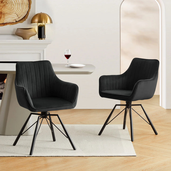 Two black Milo swivel chairs styled around a dining table