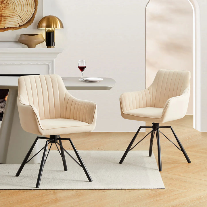 Two cream Milo swivel chairs are styled around a dining table