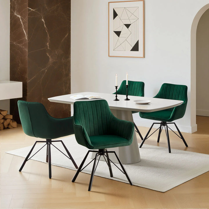 Set of four green Milo velvet dining chairs around a dining table