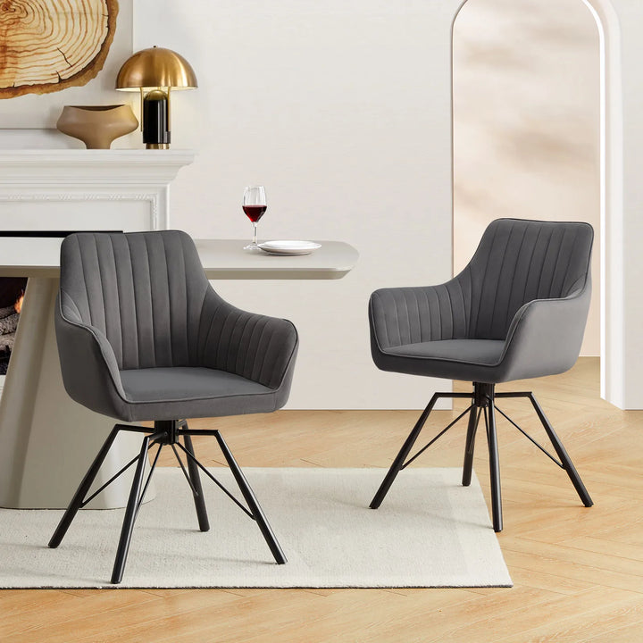 Two grey Milo swivel chairs are styled around a dining table