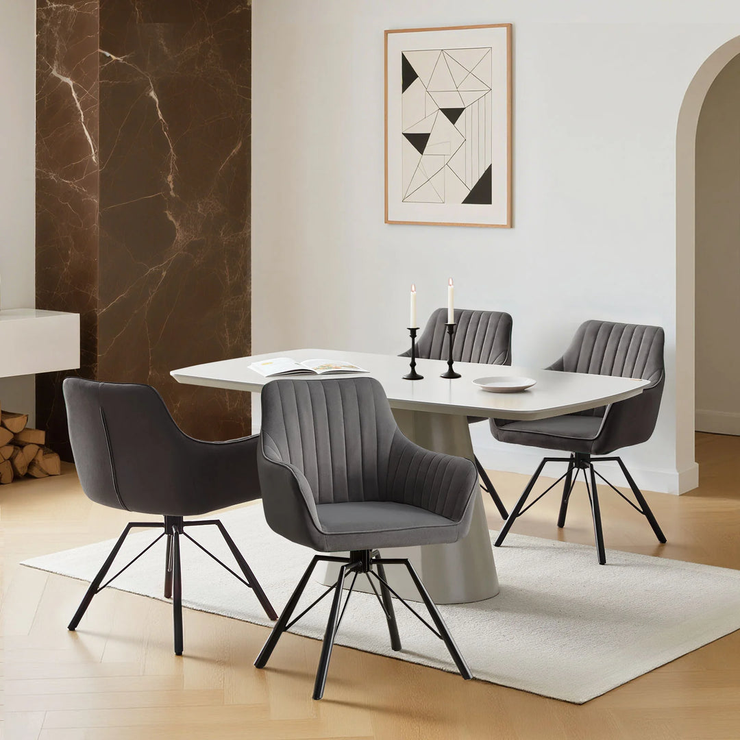 Set of four grey Milo velvet dining chairs around a dining table