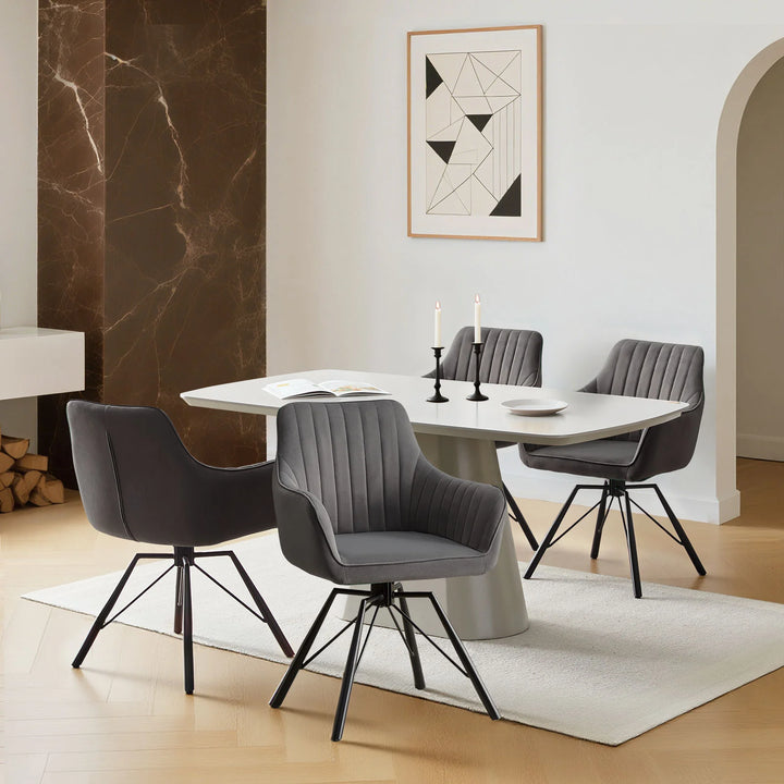 Set of four grey Milo velvet dining chairs around a dining table