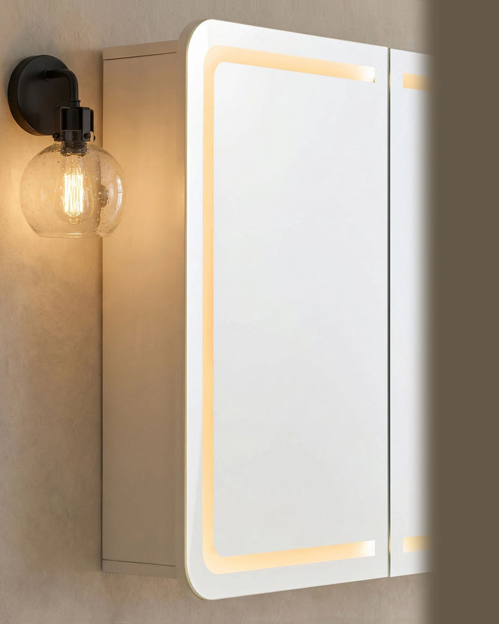 Close-up of Mira bathroom mirror cabinet mirror surface with integrated LED light strip