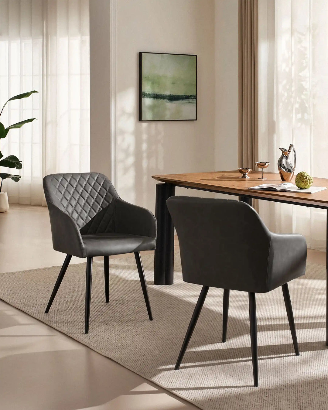 Moree dark grey Faux Leather Dining Chairs Styled Beside Modern Dining Table in Contemporary Dining Room