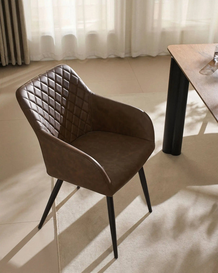 Single Moree Brown Faux Leather Dining Chair Beside Dining Table in Warm Modern Interior
