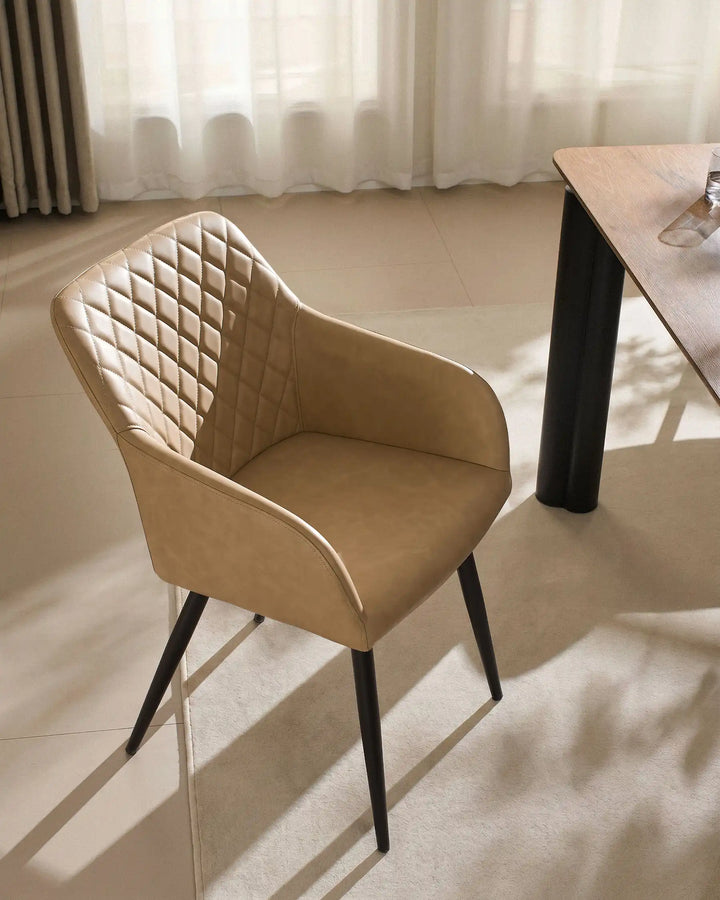 Single Moree beige Faux Leather Dining Chair Beside Dining Table in Warm Modern Interior