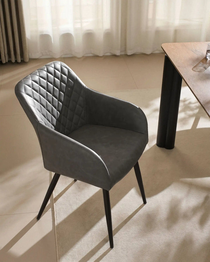 Single Moree light grey Faux Leather Dining Chair Beside Dining Table in Warm Modern Interior