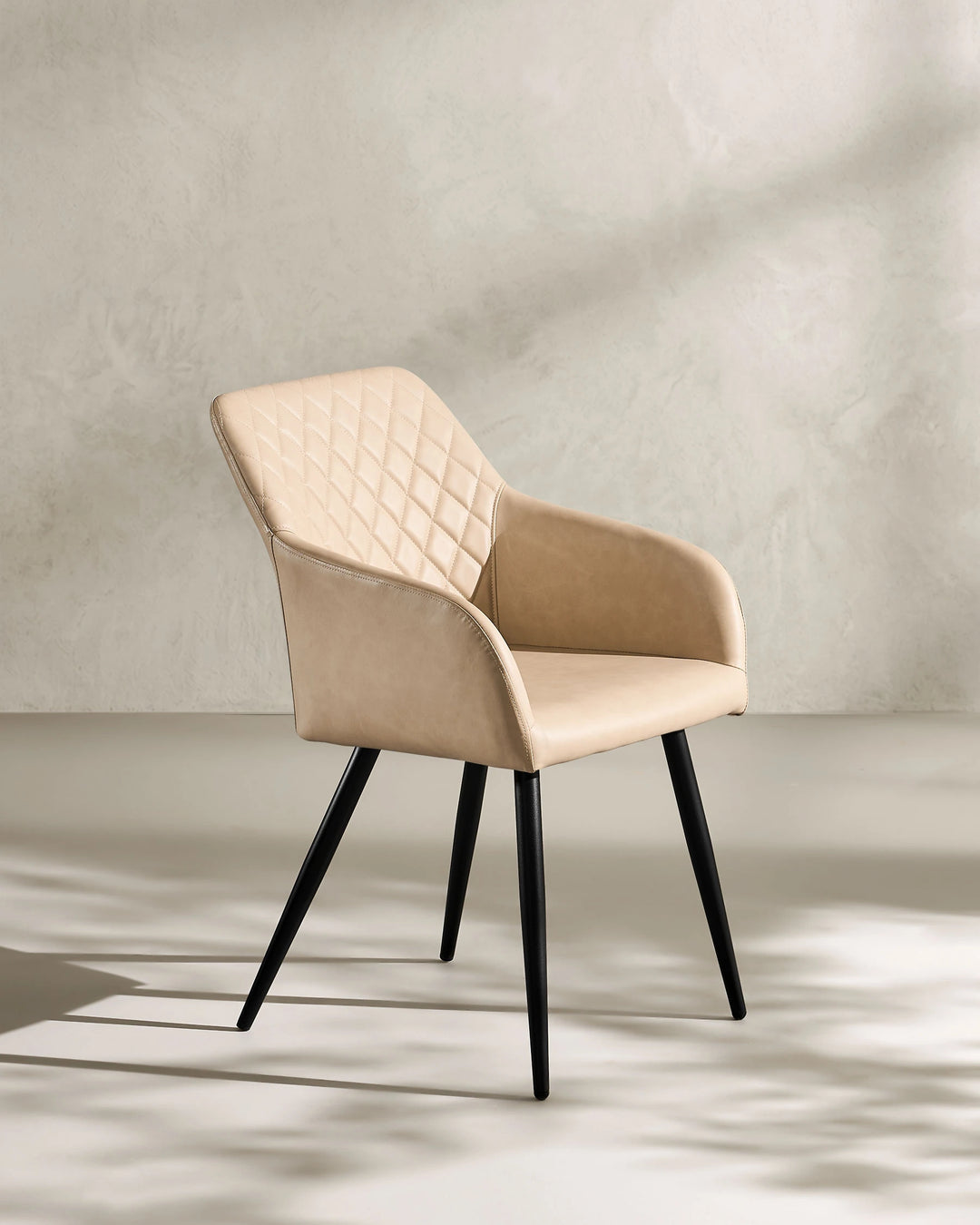 Moree beige Faux Leather Dining Chair Side 45 Degree View on White Background with Natural Shadow