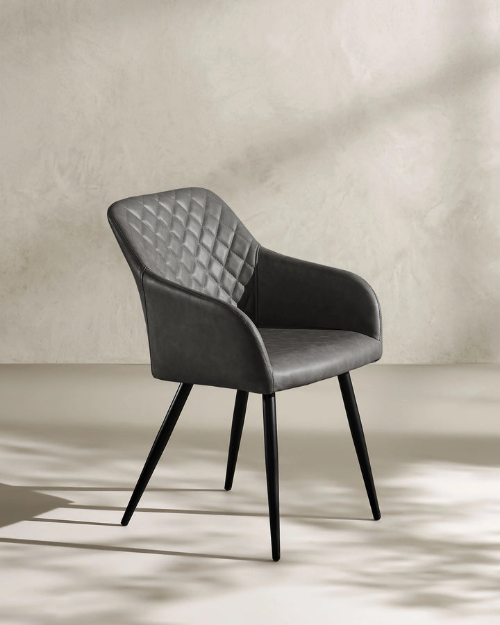 Moree dark grey Faux Leather Dining Chair Side 45 Degree View on White Background with Natural Shadow