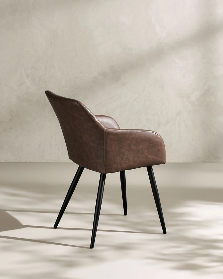 Moree Brown Faux Leather Dining Chair Side 135 Degree View on White Background with Natural Shadow