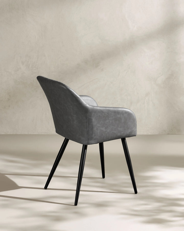 Moree light grey Faux Leather Dining Chair Side 135 Degree View on White Background with Natural Shadow