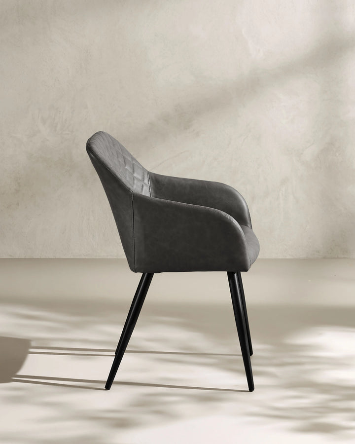 Moree dark grey Faux Leather Dining Chair Side 90 Degree View on White Background with Natural Shadow