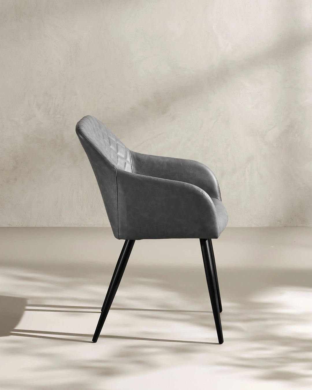 Moree light grey Faux Leather Dining Chair Side 90 Degree View on White Background with Natural Shadow