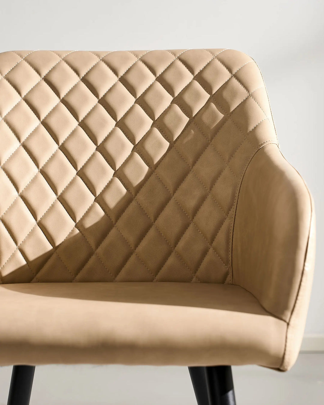 Front Detail of Moree beige Faux Leather Dining Chair Seat, Armrests and Backrest