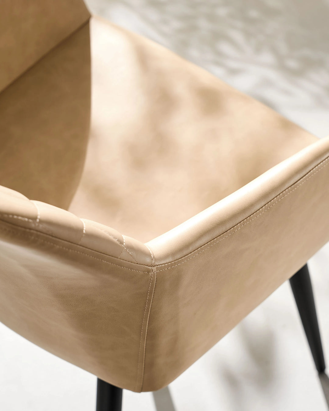 Top View of Wide Padded Seat on Moree beige Faux Leather Dining Chair