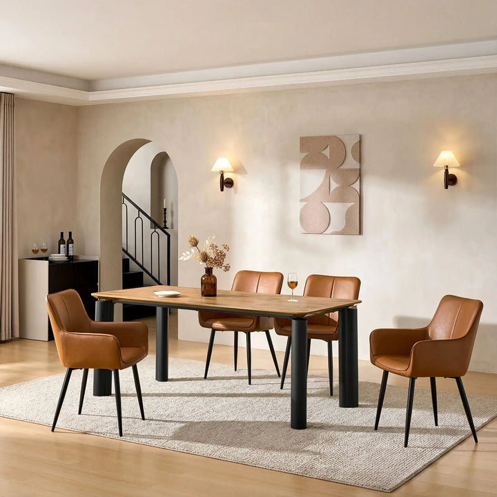 Side view of four Muhsina brown faux leather dining chairs in a dining room setting