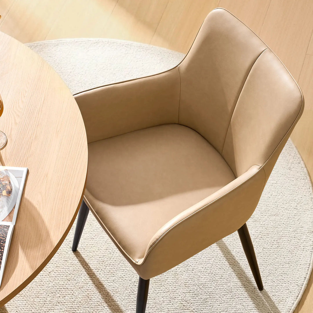 Top view seat detail of Muhsina beige faux leather dining chair with padded cushion