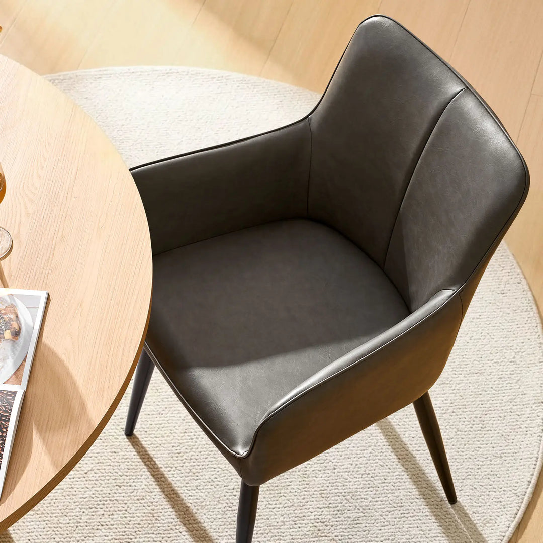 Top view seat detail of Muhsina grey faux leather dining chair with padded cushion