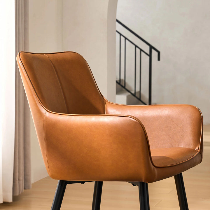 Side view armrest detail of Muhsina brown faux leather dining chair