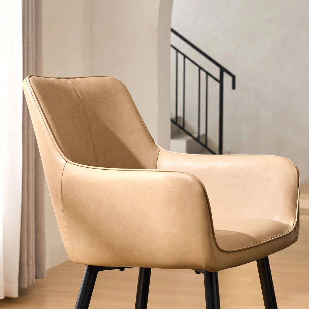 Side view armrest detail of Muhsina beige faux leather dining chair