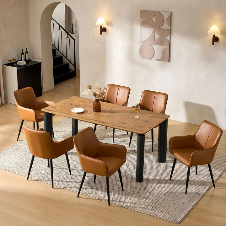 Top view of six Muhsina brown faux leather dining chairs סביב a dining table