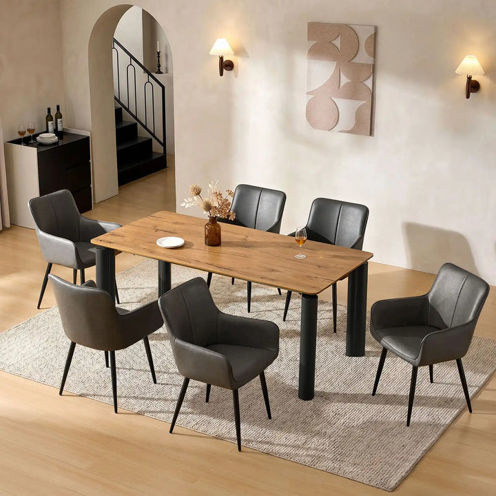 Top view of six Muhsina grey faux leather dining chairs around a dining table