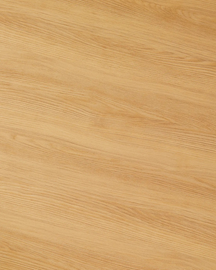 Close-up of the Nara dining table's oak-effect finish, highlighting the natural-looking wood grain and warm honey-toned colour