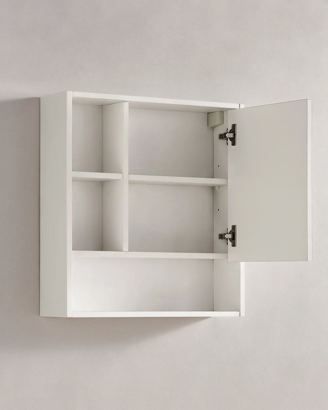White bathroom mirror cabinet with the mirrored door open to reveal internal shelving and the metal hinges for easy access to stored toiletries.