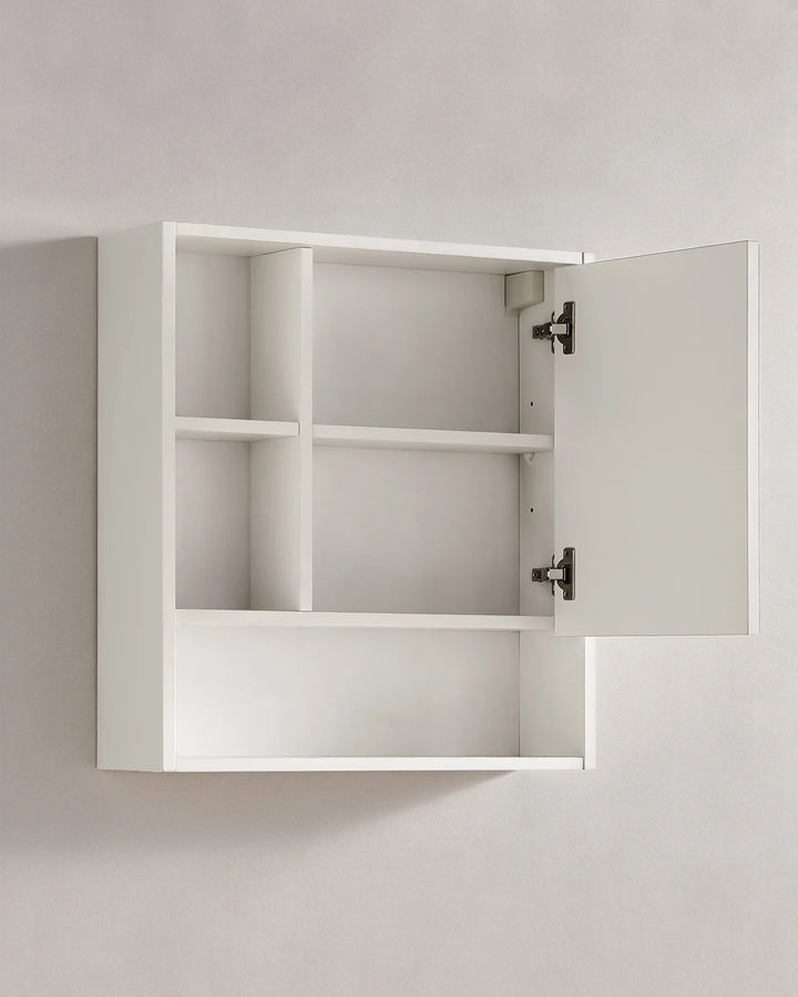 White bathroom mirror cabinet with the mirrored door open to reveal internal shelving and the metal hinges for easy access to stored toiletries.