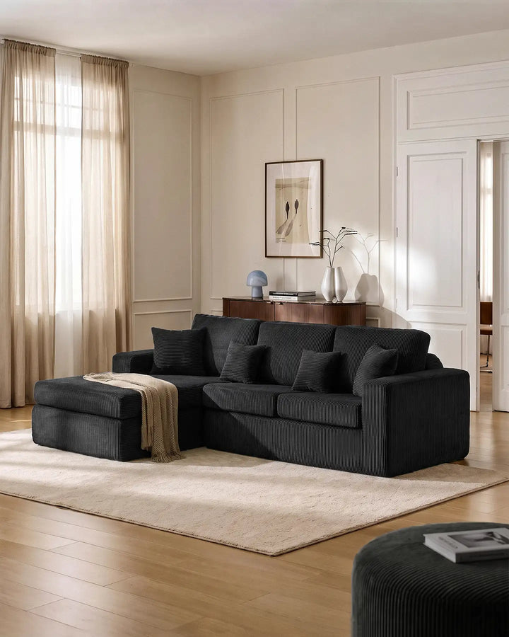 Nodo black modular corner sofa with chaise in a modern living room