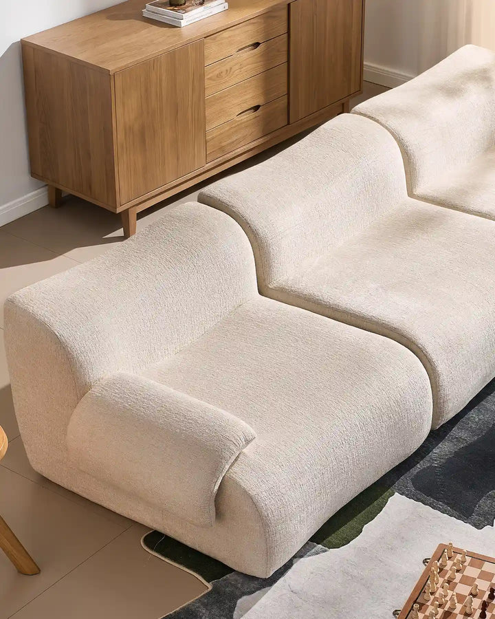 Close-up of the Nola sofa sections joined together, showcasing the seamless look and generous seating depth.
