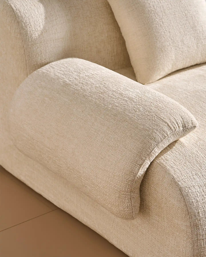 Luxury cream chenille fabric texture of the Nola sofa, durable and soft-to-the-touch.