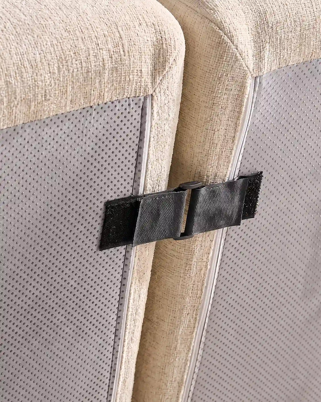 Under-sofa view showing the heavy-duty interlocking clips that keep Nola modular sections securely together.
