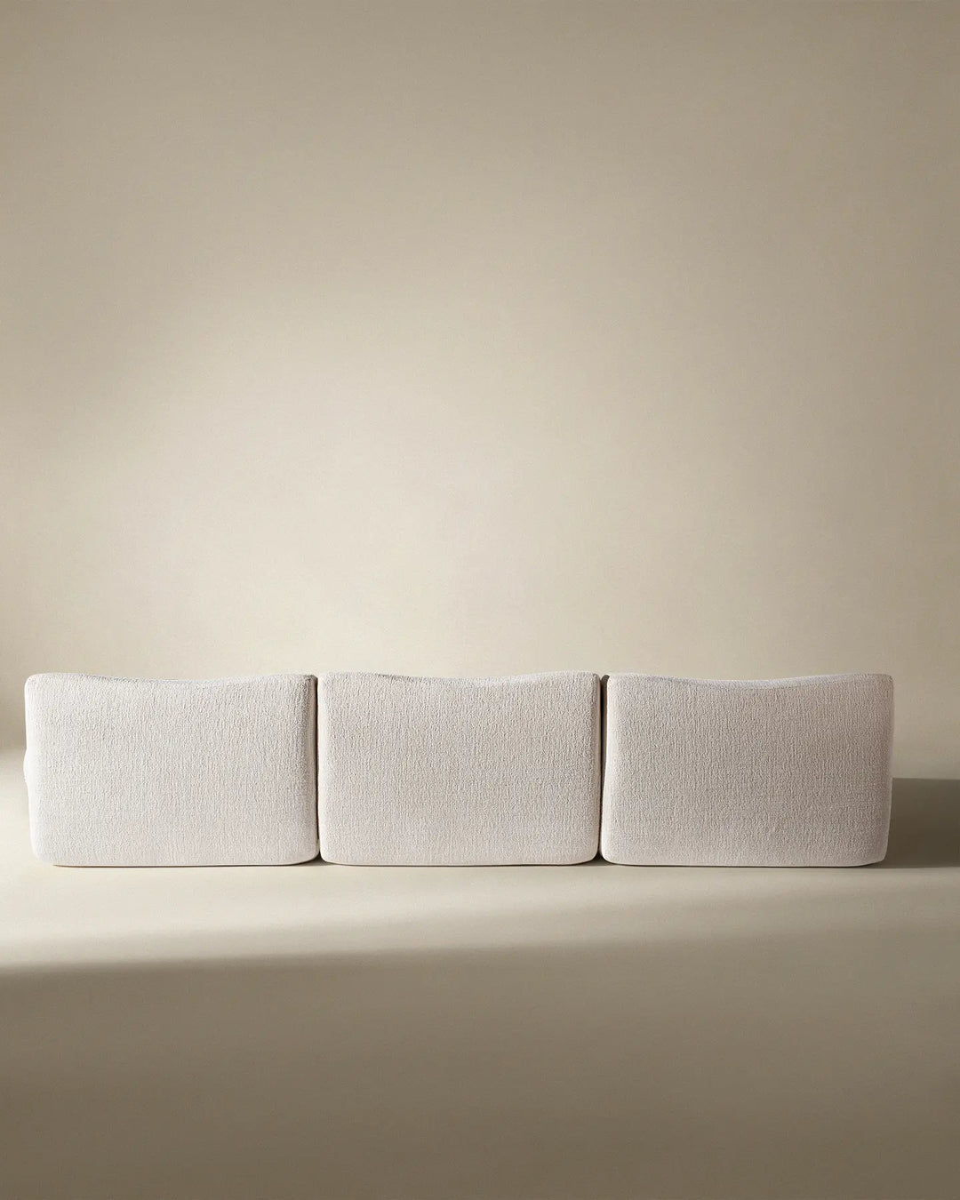 Rear view of the Nola sofa, showcasing the clean, finished back suitable for open-plan living spaces.