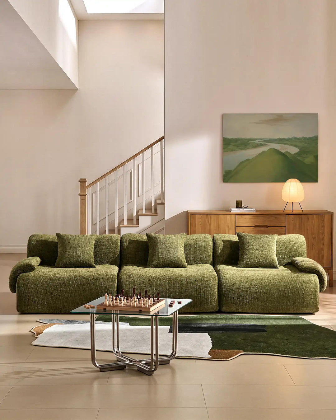 Nola 4-seater modular sofa in green chenille fabric, styled in a minimalist modern living room.