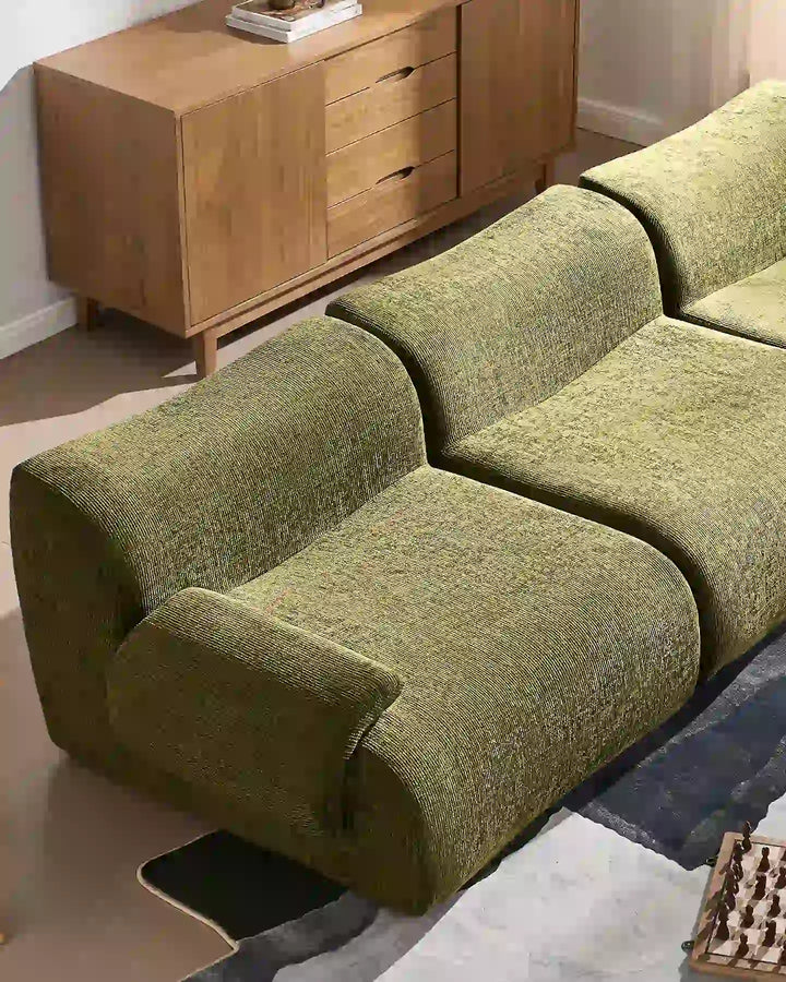 Close-up of the Nola sofa sections joined together, showcasing the seamless look and generous seating depth.