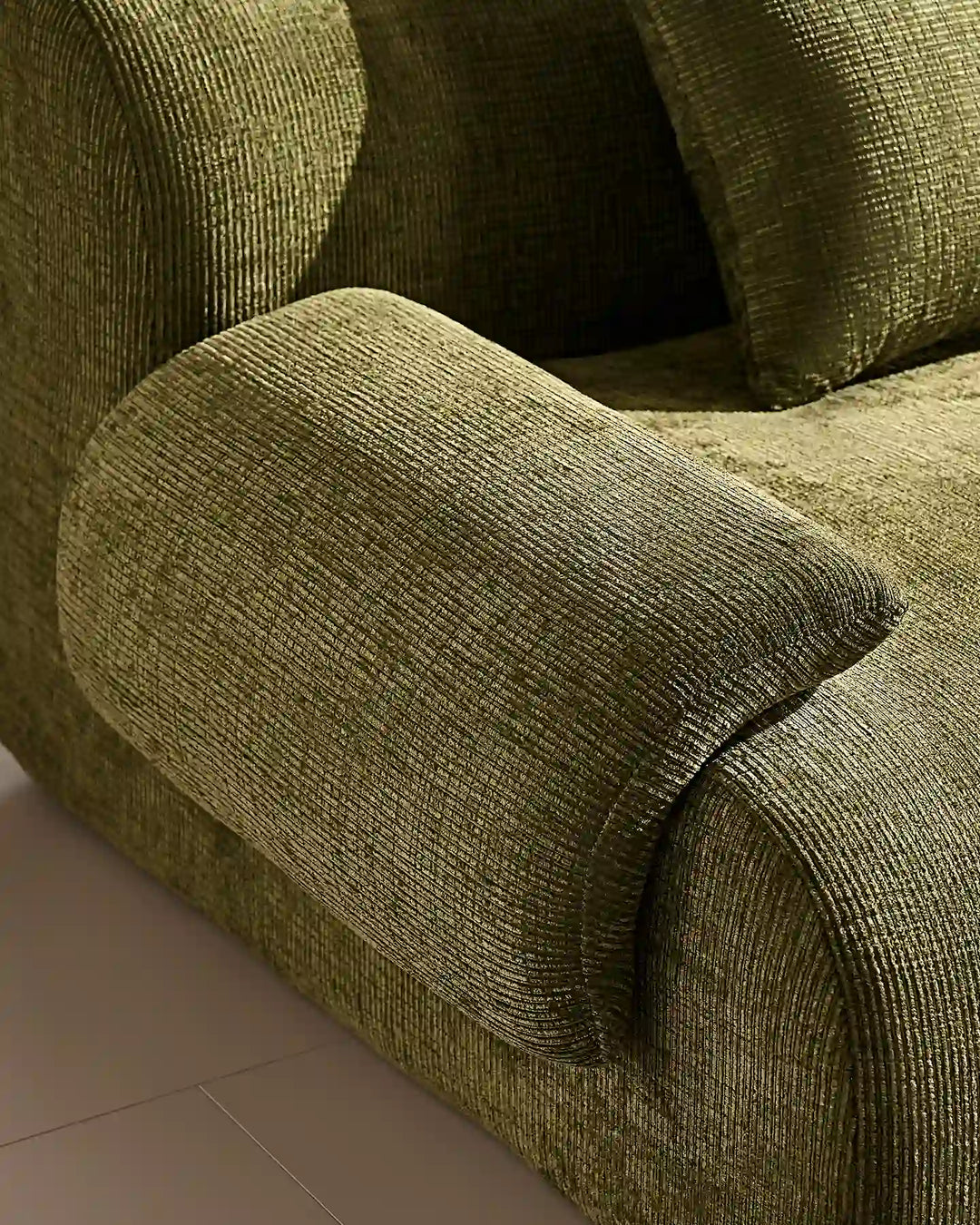 Luxury cream chenille fabric texture of the Nola sofa, durable and soft-to-the-touch.