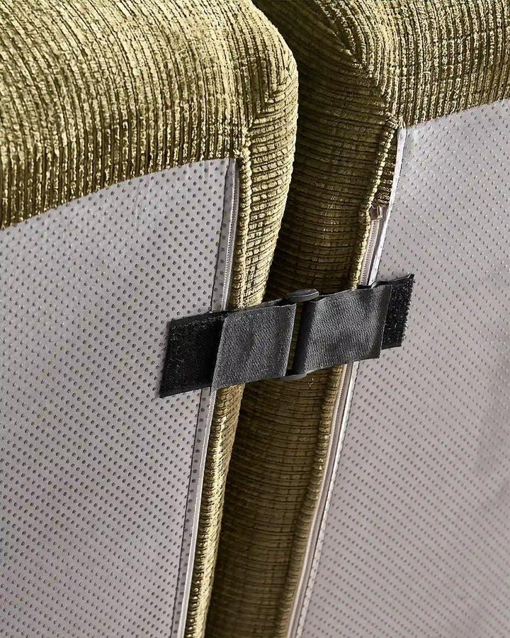 Under-sofa view showing the heavy-duty interlocking clips that keep Nola modular sections securely together.