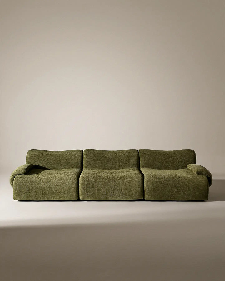 Front-on studio view of the Nola modular sofa, highlighting its minimalist and symmetrical aesthetic.