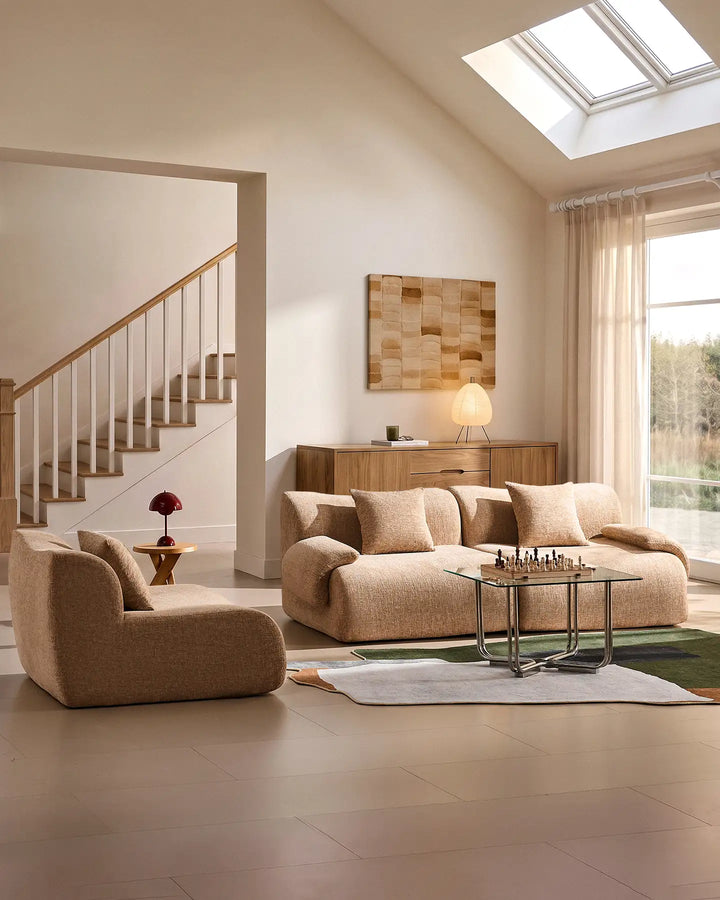 Demonstrating the versatility of the Nola modular sofa: the middle module is removed to create a separate armchair and a more compact sofa arrangement.